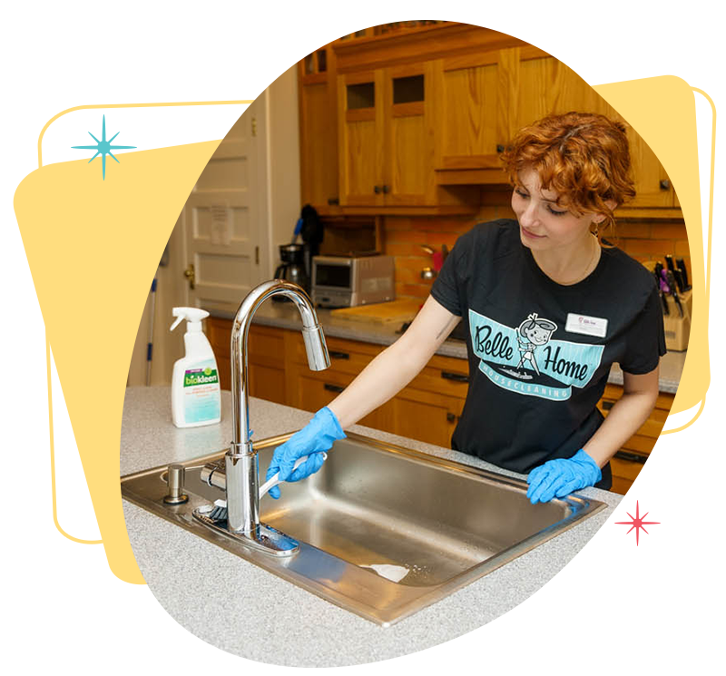 Belle Home cleaner scrubbing a kitchen sink