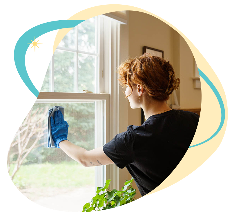 Belle Home cleaner washing an office window