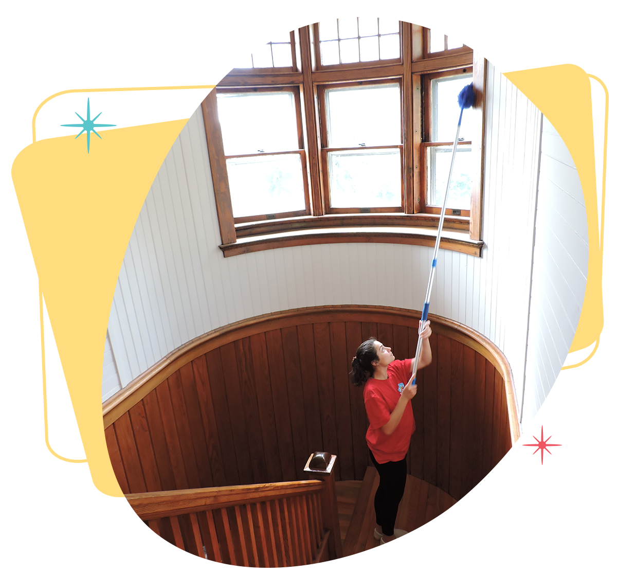 Belle Home cleaner dusting a high window