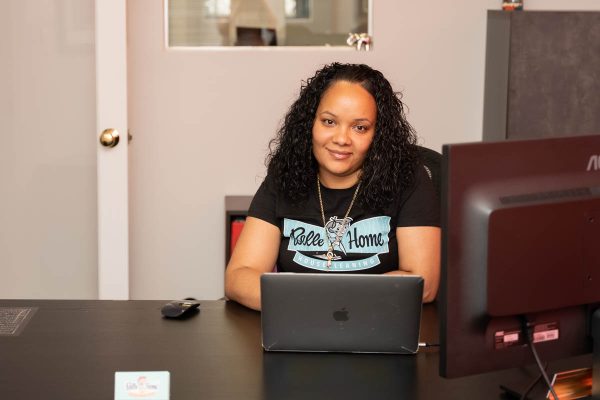 A Belle Home office team member at her laptop