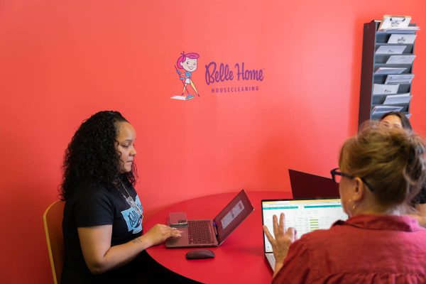 Two Belle Home team members working together