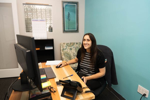 A Belle Home office team member at her desk